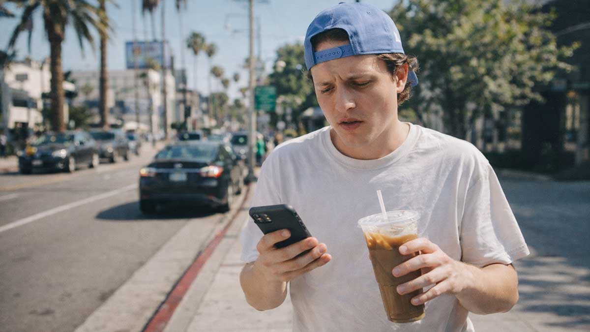 A candid photo of Conner Wood laughing at a cafe