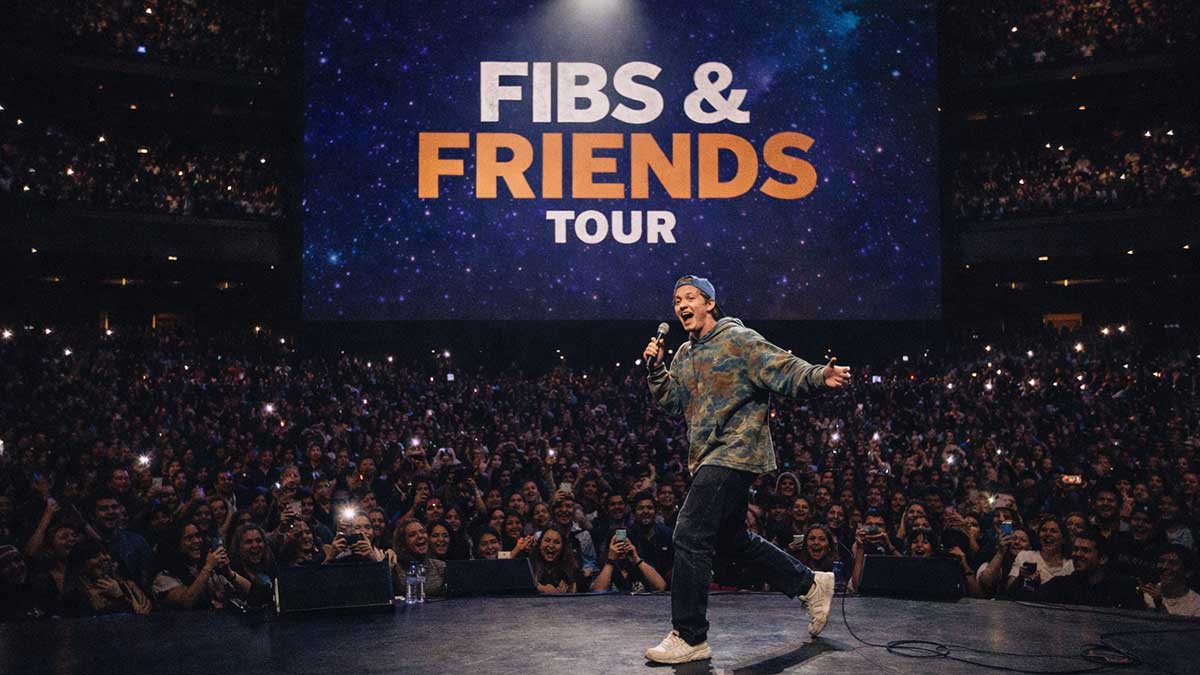 Conner Wood performing stand-up comedy on stage to a sold-out crowd
