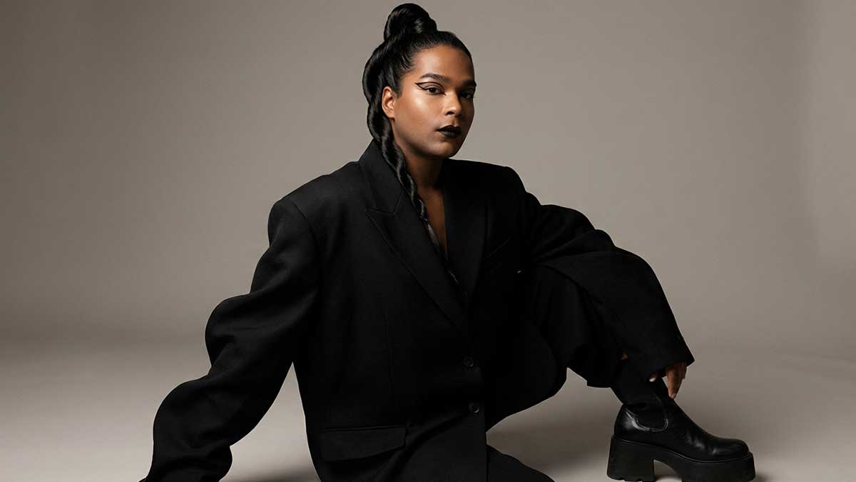 Devin Halbal posing in a high-fashion outfit for a modeling campaign