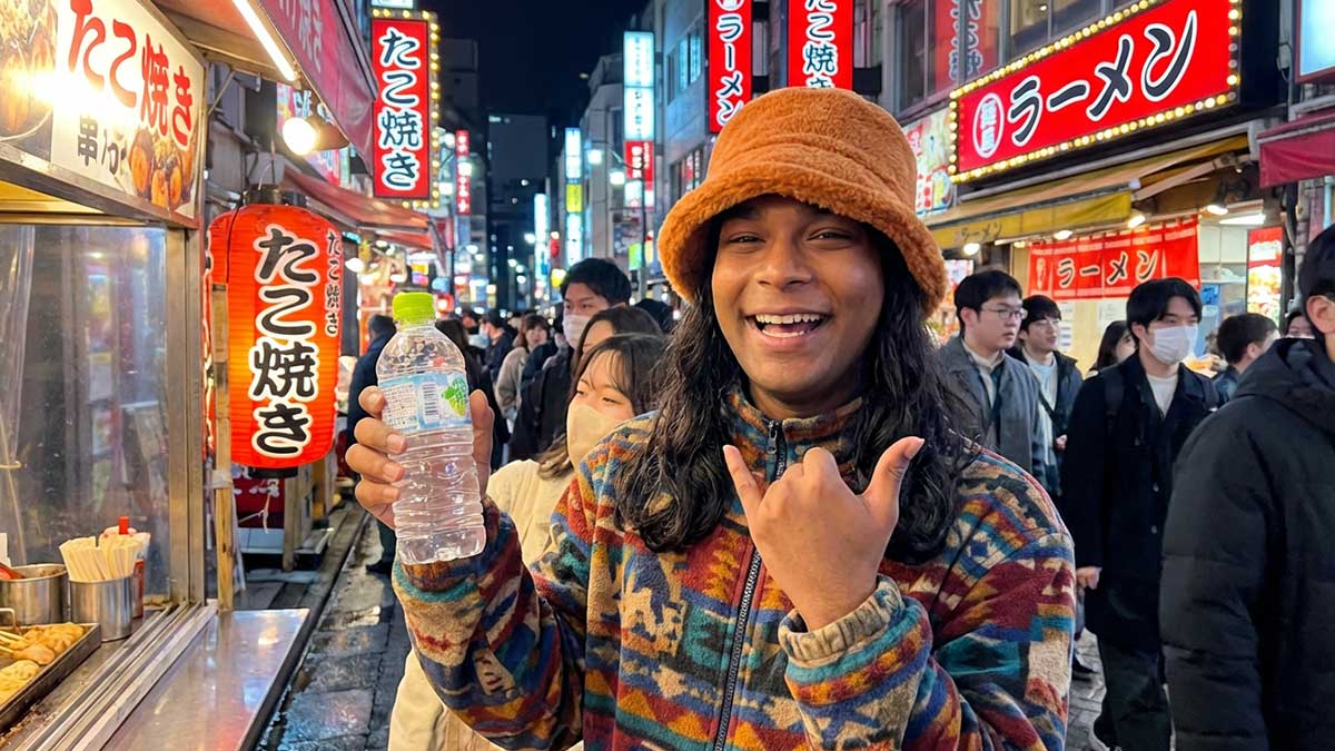 A selfie of Devin Halbal in front of a famous landmark in Japan