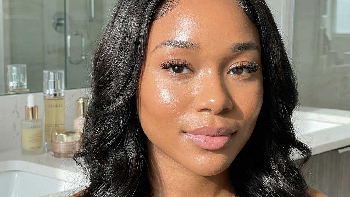 A close-up high-fashion beauty portrait of Hikari Fleurr with glowing skin