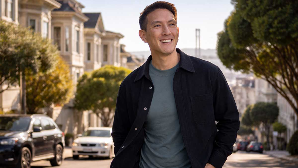 A lifestyle photograph of Humphrey Yang walking in a San Francisco neighborhood.