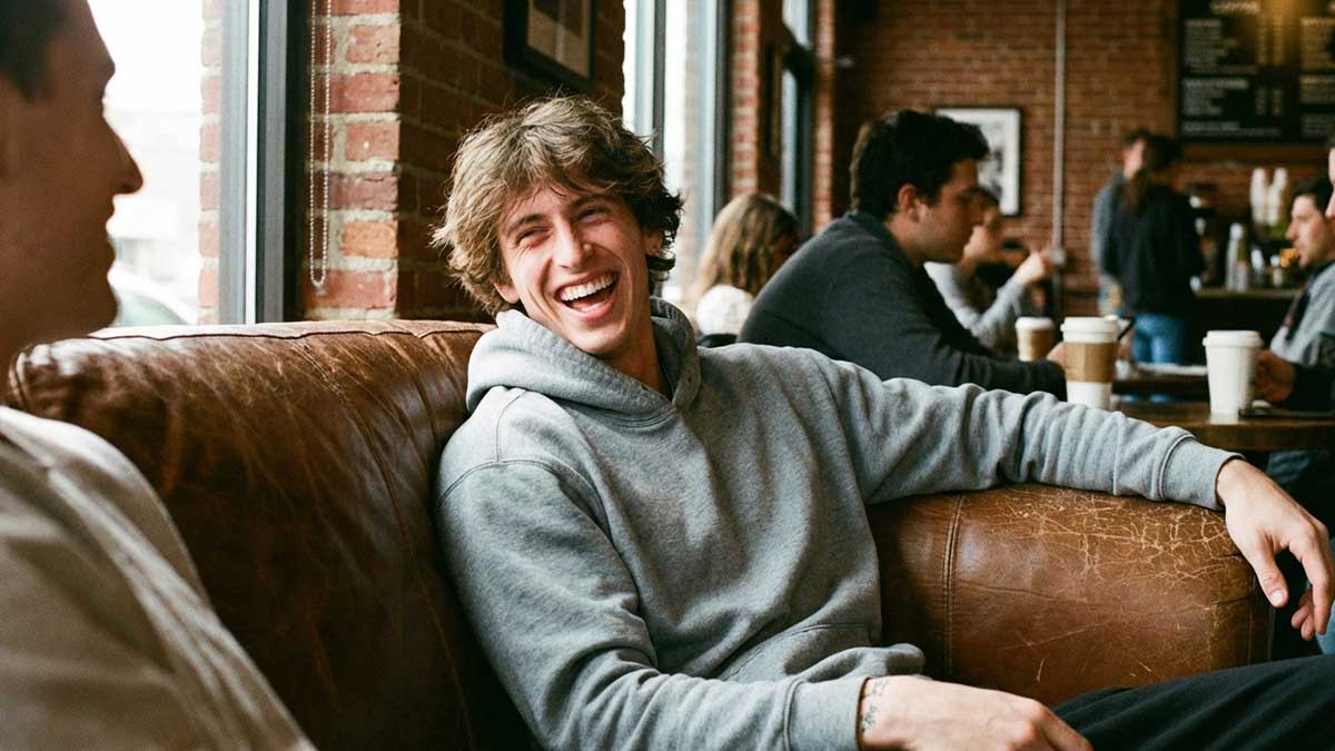 A candid photo of Jacob Day laughing with friends