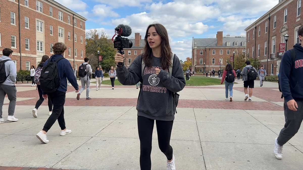 Katelyn Ernst filming a vlog on her college campus