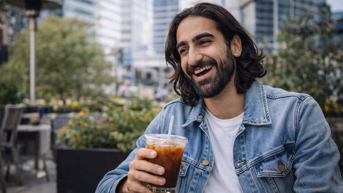 A candid photo of Sammie Dojaking smiling off camera